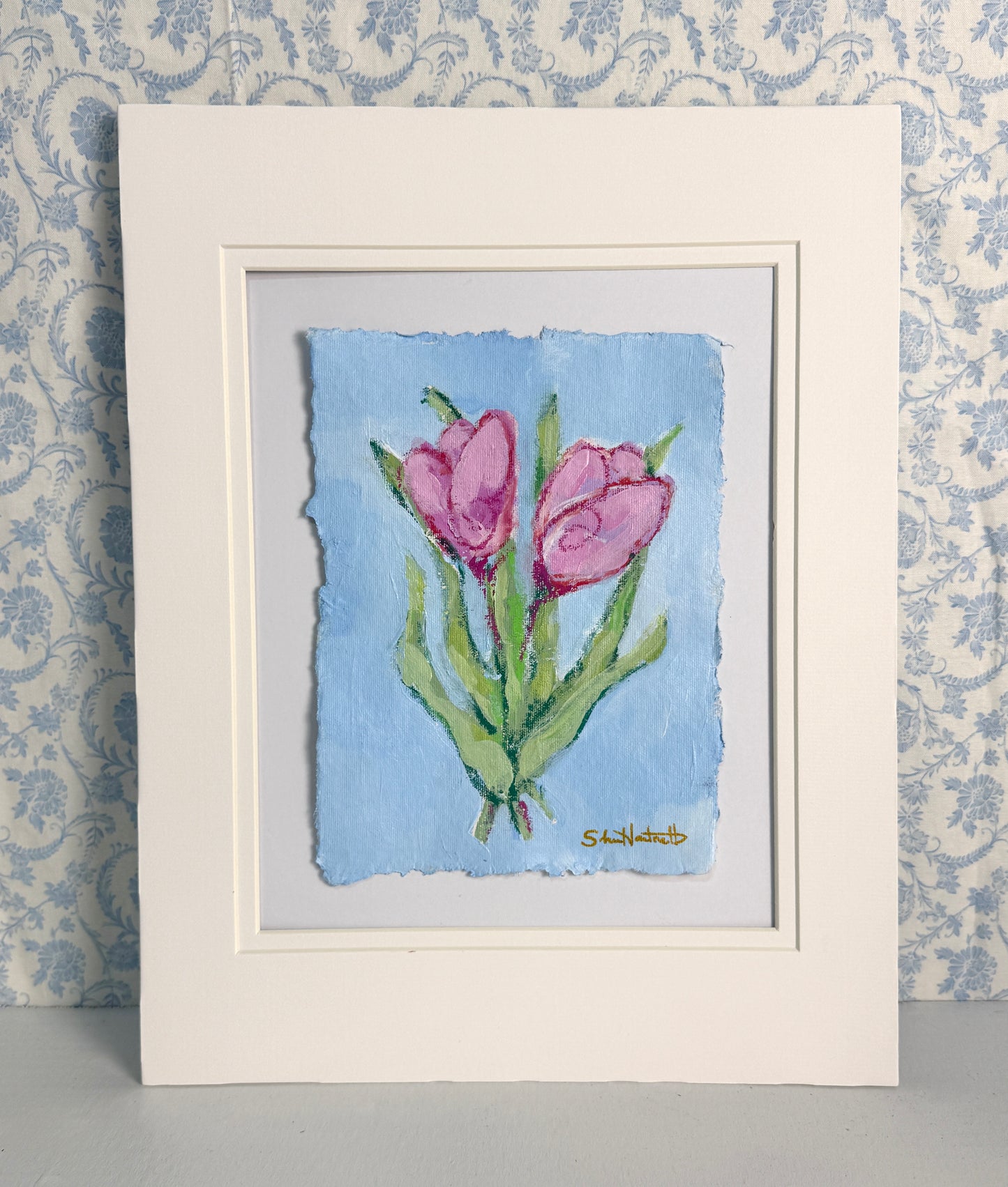 Original pink tulip painting by Sheri Hartnett — acrylic and pastel on handmade deckled-edge paper, shown matted in a cream 11×14 double mat.